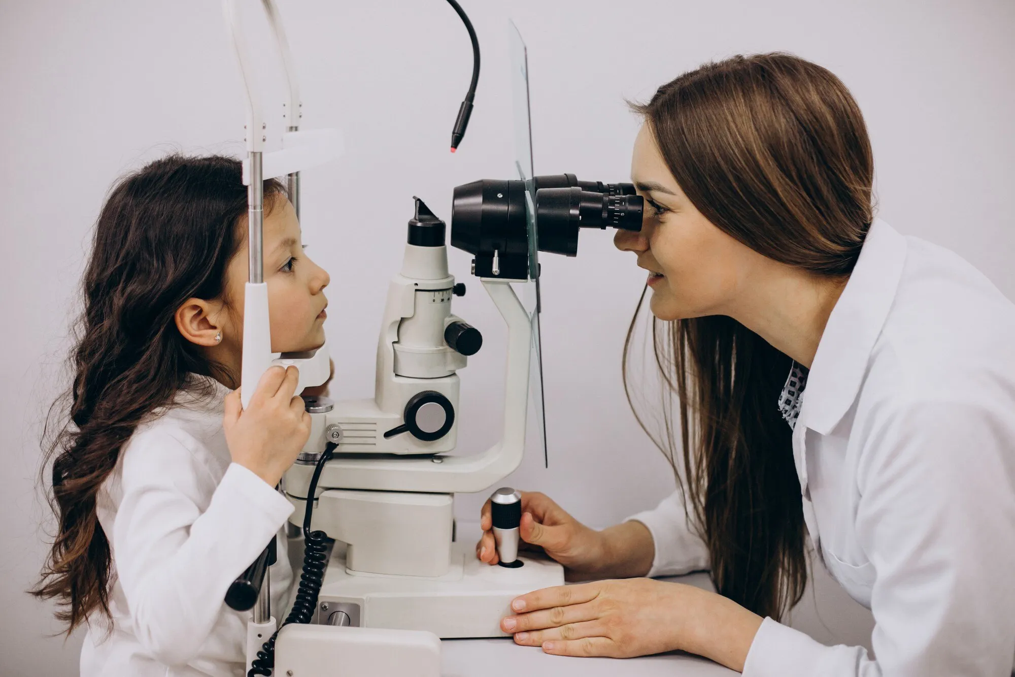 Child receiving eye exam from optometrist